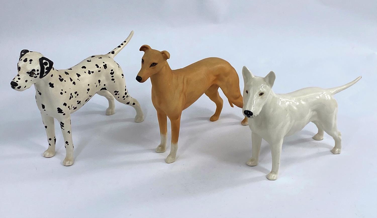 Three Beswick dog figures, Dalmation 961, Bull Terrier 970, and Greyhound matt glaze 972