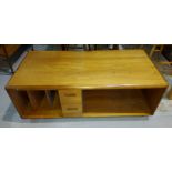 A mid 20th century teak coffee table with shelves and drawers below, length 161cm, height 45cm depth