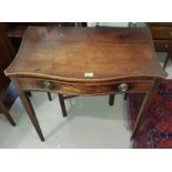 A 19th century mahogany side table with single drawer, serpentine front on tapering legs