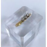 A 3 stone diamond dress ring, the shank stamped 18CT PLAT, 2.1gm size M