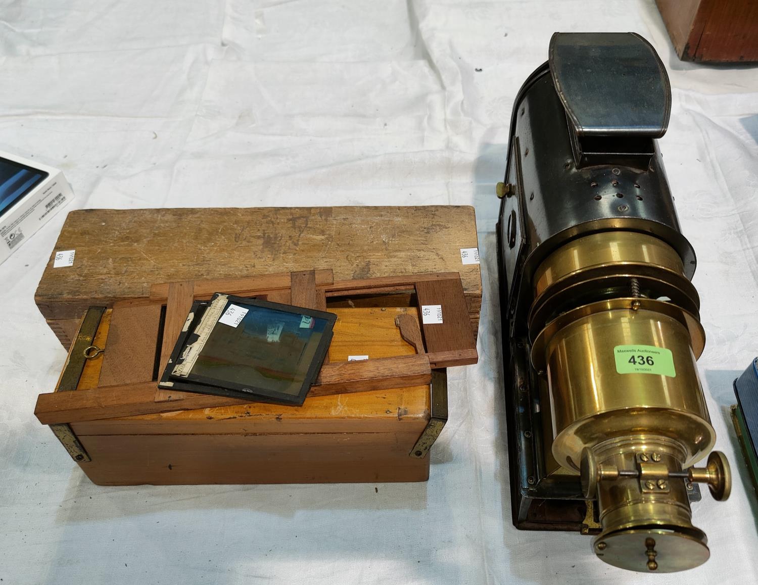 A converted brass and nickel lantern projector and a collection of various slides etc.