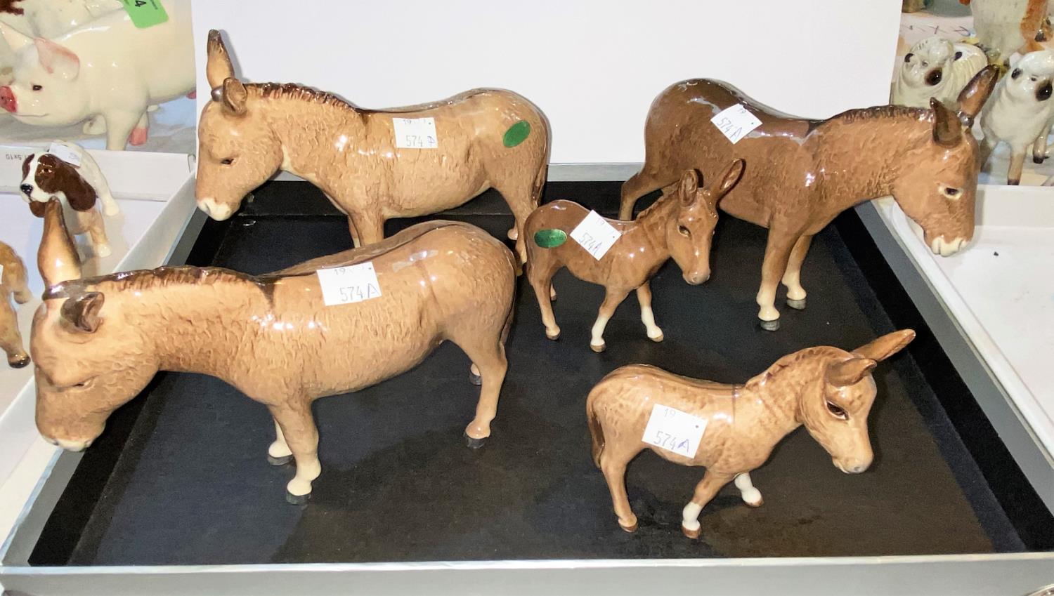 Five Beswick donkeys, three 2267, two foals 2110