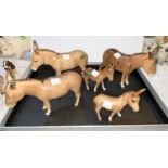 Five Beswick donkeys, three 2267, two foals 2110