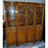 A yew wood reproduction breakfront bookcase
