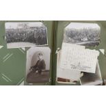 An early 20th century album of picture postcards including around 150 photographic cards depicting