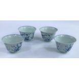 Four Chinese blue and white tea bowls with Prunus blossom decoration with birds, a character mark to