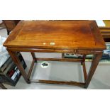An oriental hardwood side table; a similar smaller table.