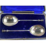 A pair of Arts and Crafts silver seal top anointing spoons, case, maker William Hutton, London,