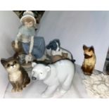 A small Beswick cat, a Lladro polar bear and a selection of Nao animals etc