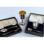 A hallmarked silver goblet, Birmingham 1974; a christening egg cup and spoon, boxed, Sheffield 1934;