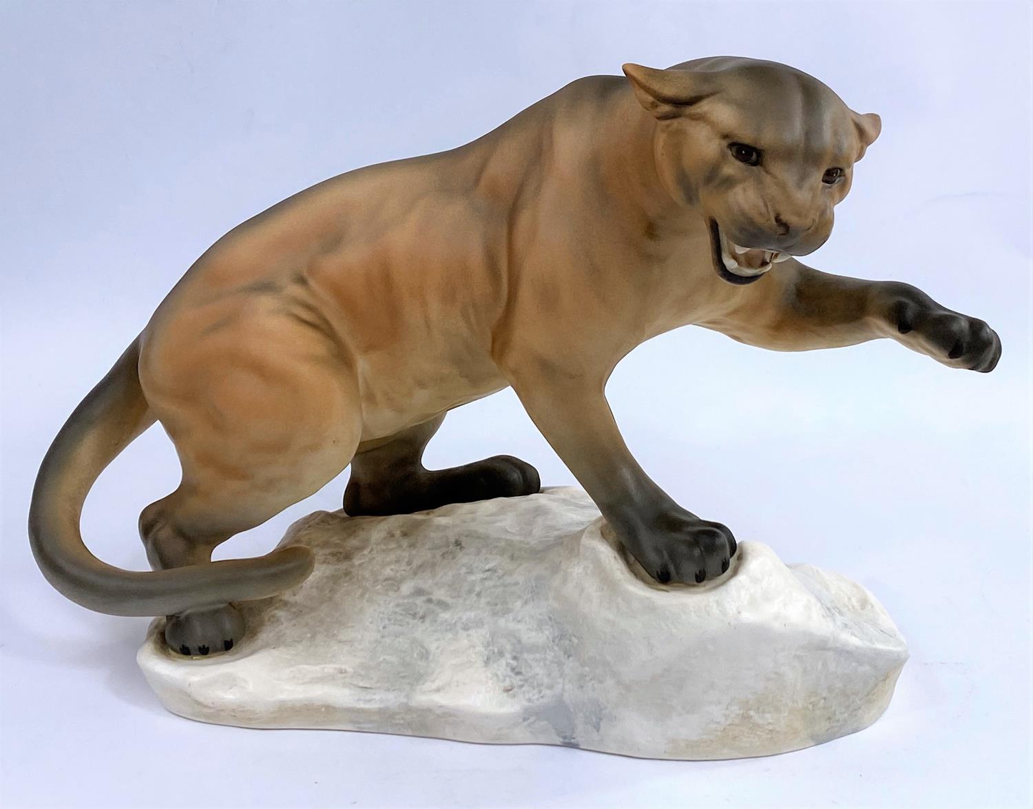 A large Beswick puma on a rock, matt glaze, number: 1072