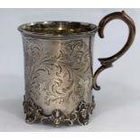 A Victorian silver cylindrical christening mug with chased acanthus decoration and cst foot rim,