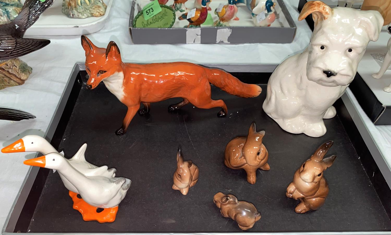 A selection of Beswick animals: a fox, a seated puppy 308, a goup of ducks and a selection of