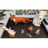 A selection of Beswick animals: a fox, a seated puppy 308, a goup of ducks and a selection of