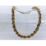 A 9ct hallmarked gold rope twist yellow metal bracelet, 4.7gms.