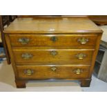 A good quality 20th century oak Georgian style chest of three drawers on bracket feet with canted