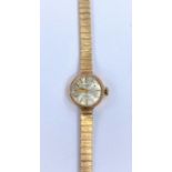 A ladies Summit wristwatch on 9 carat hallmarked gold bracelet, 15.3 gm gross