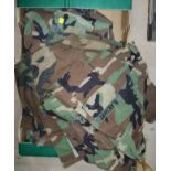 A selection of Military style jackets in camouflage pattern some bearing various cloth badges etc.