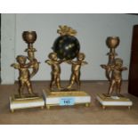 An ormolus 3 piece clock garniture in the form of cherubs holding a spherical clock and 2 side