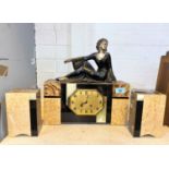 An Art Deco style clock garniture with rectangular clock body made from marble and similar stone,