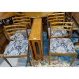 A 1960's teak G-Plan dining suite comprising drop leaf table and 4 ladder back chairs