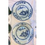 A pair of 18th century Chinese blue and white shallow dishes with traditional mountain scenes,