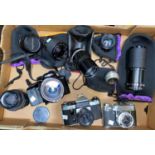 A MINOLTA DYMAX 5xi SLR camera, 2 others and a selection of lenses.
