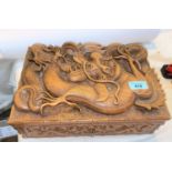 A late 19th / early 20th century Chinese carved wood jewellery box with dragon in high relief