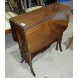 An Edwardian mahogany Sutherland table; a 6 pane wall mirror