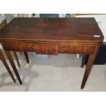 A 19th century mahogany inlaid fold over tea table with tapering legs