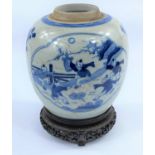 A Chinese blue and white ceramic ginger jar, decorated with panels to either side, one of children