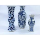 Three Chinese blue and white vases, a knot vase with dragon, flowers and trees, a 4 character mark