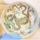 A very large Chinese famille verte charger with large central highly detailed 4 clawed dragon,