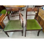 A Regency period set of 7 (6 + 1) dining chairs with rope backs and wide top rails, on reeded