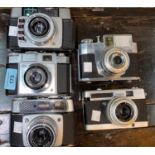 A ZEISS IKON Cntina 35mm camera and 4 others.