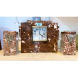 An Art Deco style clock garniture with rectangular clock garniture with matching side pieces, a