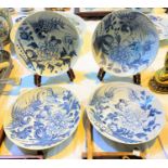 A set of 4 Chinese blue and white shallow dishes decorated with foliage and exotic birds, square
