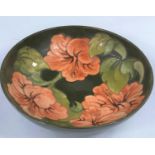 A Moorcroft Hibiscus pattern large bowl with green ground, monogramed WM to bases, diameter 26cm