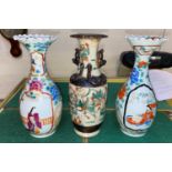 An antique Chinese ink stick decorated with characters; two Chinese vases with ribbed rim and