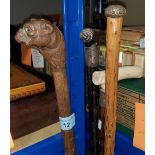 A walking stick with cat and dog carved handle, 3 other vintage walking sticks