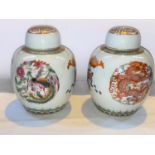 A pair of Chinese ceramic ginger jars with polychrome decoration of dragons and mythical birds, both
