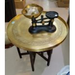 Two occasional tables with brass tops; a set of vintage scales; brassware