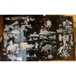 A set of four Japanese lacquered panels, with mother of pearl inlaid country scenes.