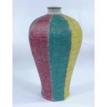 A Chinese octagonal Meiping muliti coloured vase, each side having raised scale like surface, mark