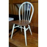 A set of 4 Ercol light wood chairs with painted legs and backs