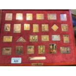 A silver gilt set modelled on stamps "The Empire Collection", original box, 15 oz