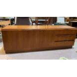 A mid 20th century teak low side unit/sideboard having two cupboards and three drawers, height 60cm,