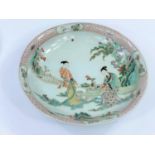 A Chinese famille verte dish decorated with two ladies working on calligraphy, diameter 29.5cm