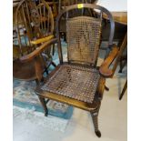 A 1930's cane seat armchair