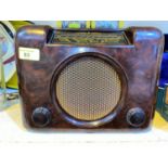 A vintage Bush, tortoise shell effect, Bakelite mains radio. (collectors item only)